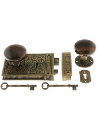 Solid Brass Scroll Rim Lock Set with Brown Swirl Porcelain Knobs.